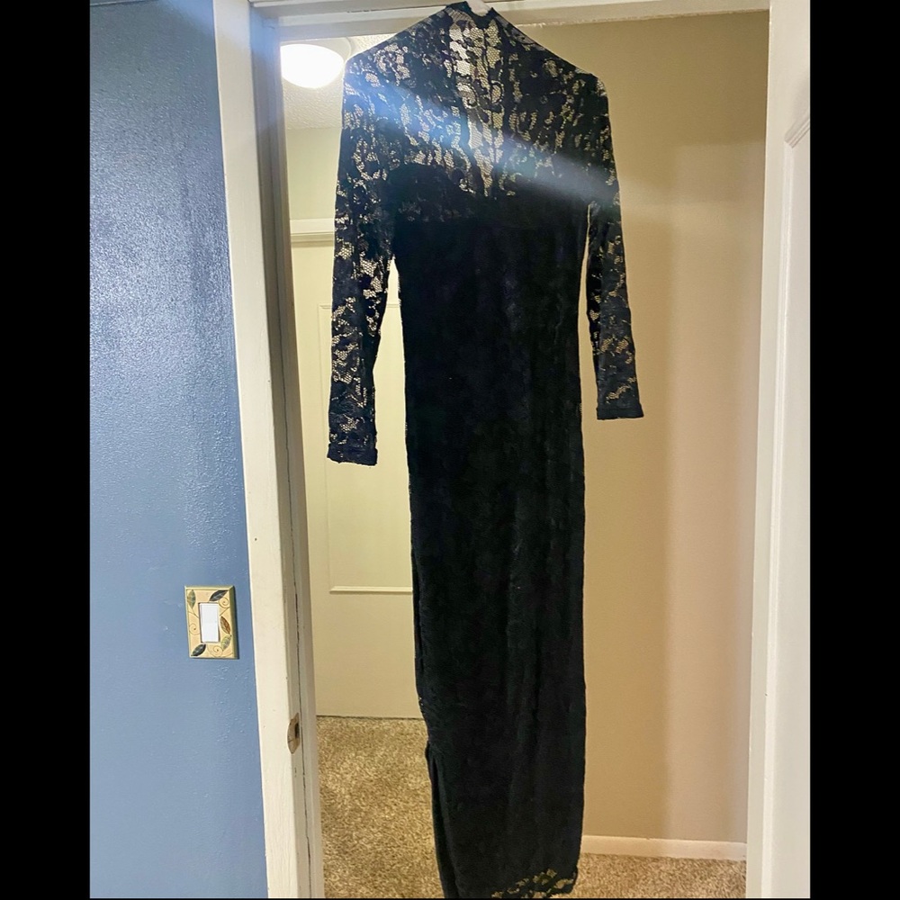 Full length, form-fitting black dress. Size small.